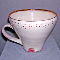 Braille cup. Earthenware with slip decoration and gold, 2005 10 cm high